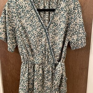 Peplum style tie front top.